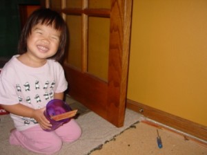 mom installing flooring for corn stove